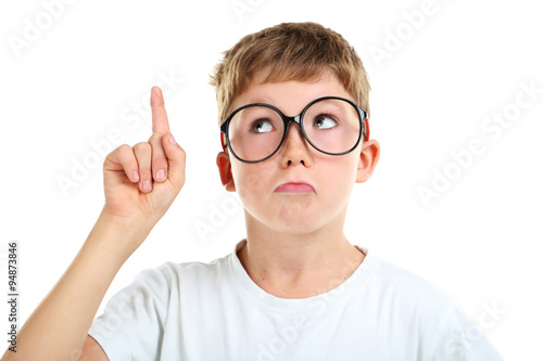 Portrait of happy little boy with eyeglasses on white background