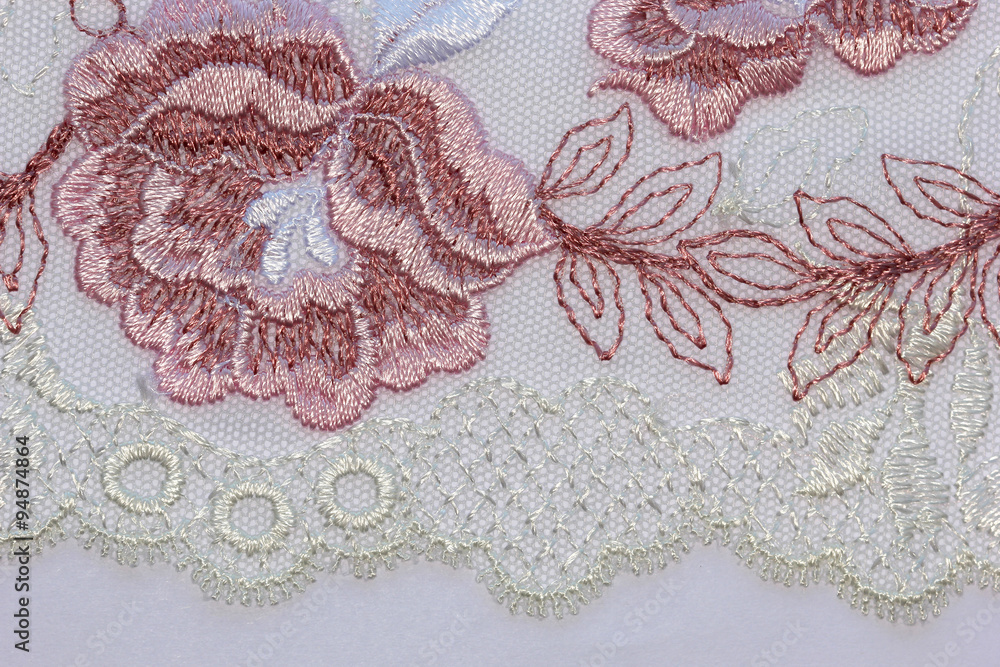 The macro shot of the pink and magenta lace texture material The macro shot of the pink and magenta lace texture material