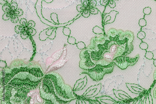 The macro shot of the green and white flowers lace texture material