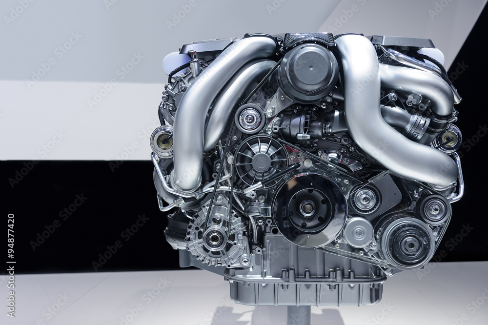 Car engine, concept of modern powerful automobile motor with metal, chrome, plastic parts, white, grey, black lines pattern on background Car engine, concept of modern powerful automobile motor with metal, chrome, plastic parts, white, grey, black lines pattern on background