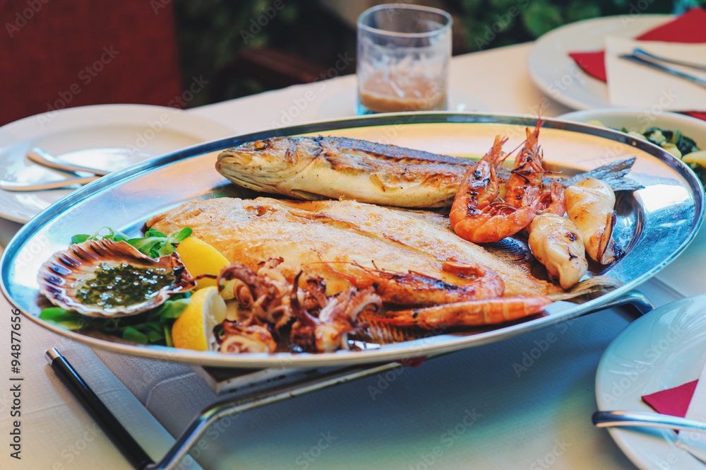 traditional slovenian and croatian cuisine, fish plate with garlic sauce, selective focus traditional slovenian and croatian cuisine, fish plate with garlic sauce, selective focus