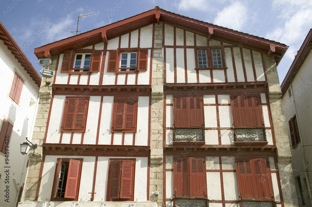 Red shutters in St. Jean de Luz, on the Cote Basque, South West France, a typical fishing village in the French-Basque region near the Spanish border