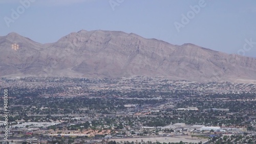 Aerial view from above looking at buildings, mountains and streets of Las Vegas, Nevada, USA