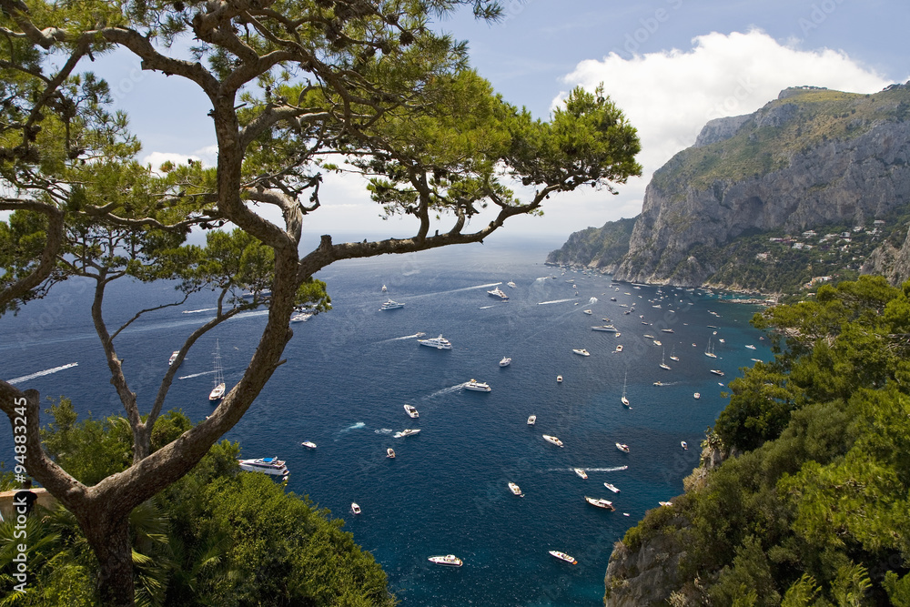 Elevated view of blue waters of the City of Capri, an Italian island off the Sorrentine Peninsula on the south side of Gulf of Naples, in the region of Campania, Province of Naples, Italy, Europe Elevated view of blue waters of the City of Capri, an Italian island off the Sorrentine Peninsula on the south side of Gulf of Naples, in the region of Campania, Province of Naples, Italy, Europe