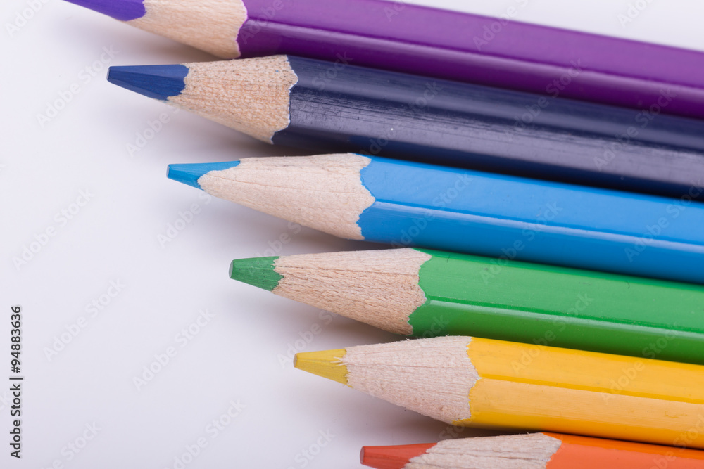Fototapeta premium Many different colored pencils on white background