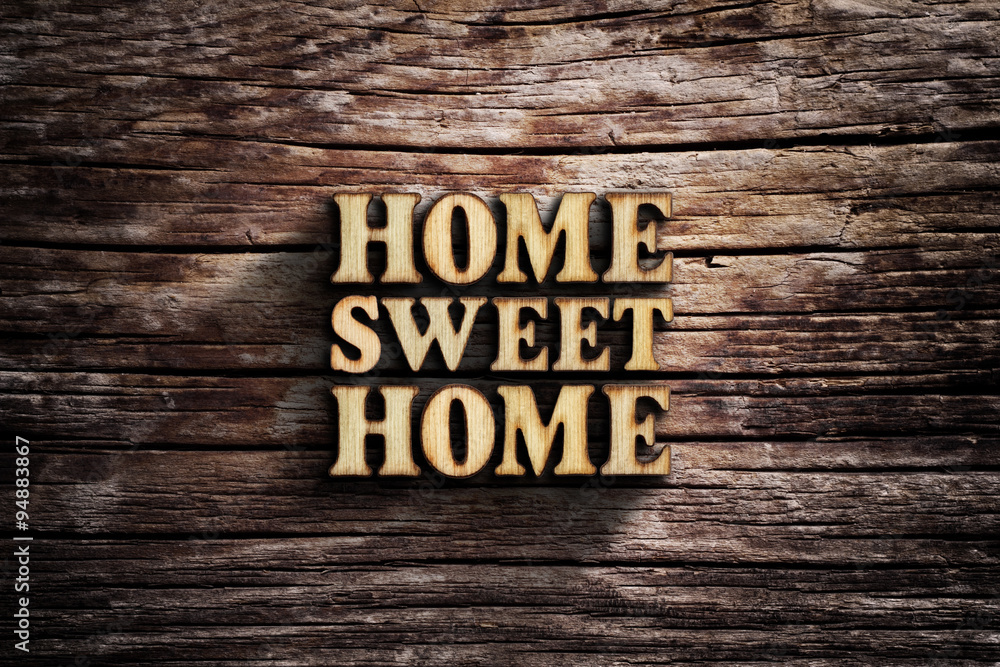 Fototapeta premium Home Sweet Home. Words on old wooden board.