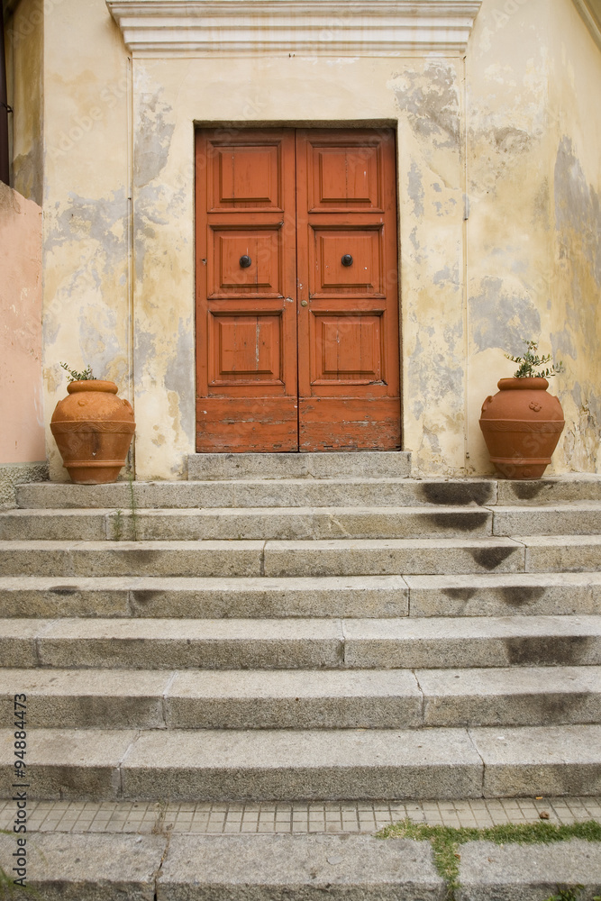 Detail shot of steps leading to two doors in Portoferraio, Province of Livorno, on the island of Elba in the Tuscan Archipelago of Italy, Europe