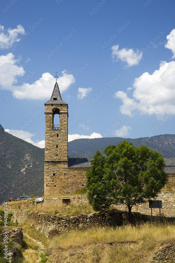 Old church tower and blue sky in Pyrenees Mountains, near La Seu d'Urgell, Cataluna, and Ansovell, province of Lleida, off N-260 Road, Spain, Europe