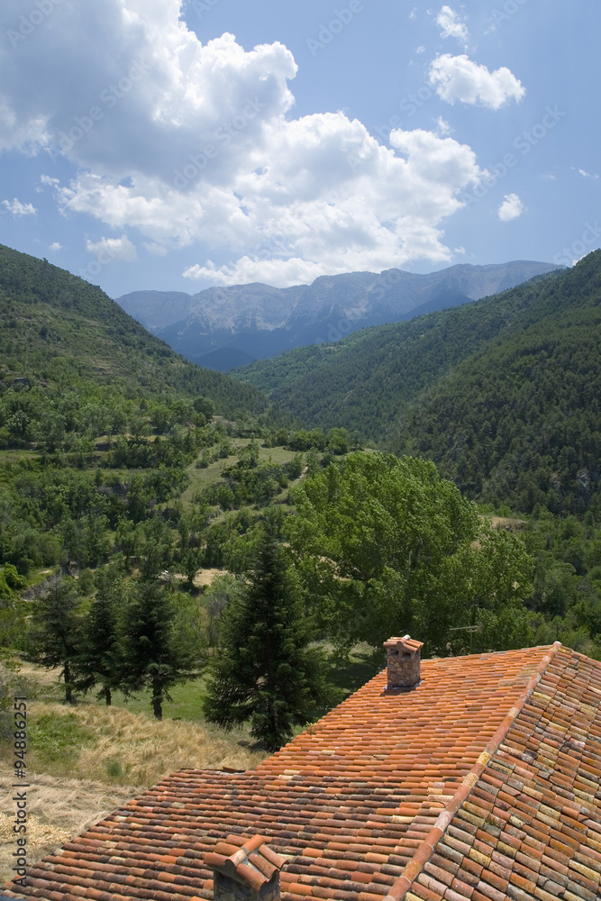 Red roof tiles in Pyrenees Mountains, near La Seu d'Urgell, Cataluna, and Ansovell, province of Lleida, off N-260 Road, Spain, Europe Red roof tiles in Pyrenees Mountains, near La Seu d'Urgell, Cataluna, and Ansovell, province of Lleida, off N-260 Road, Spain, Europe