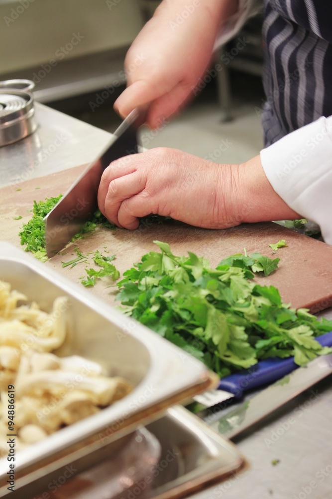 chef chopping parsley