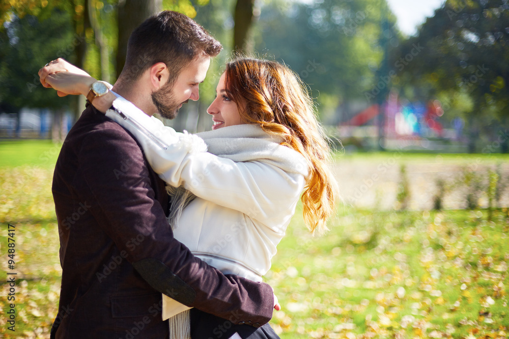 Fototapeta premium Young people kissing outdoors