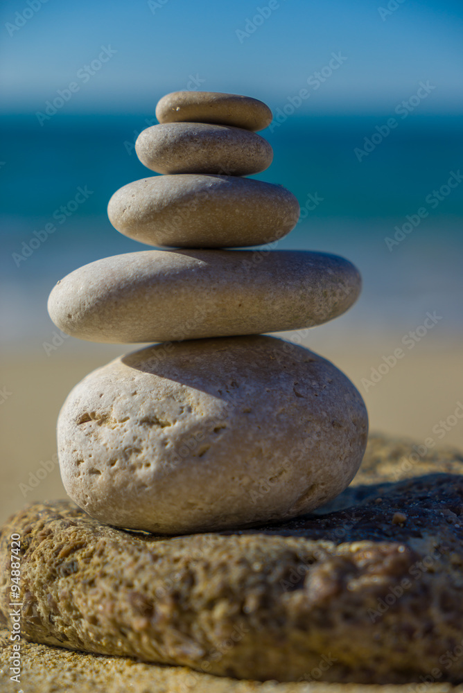 Stones balance, pebbles stack over blue sea in Croatia. Stones balance, pebbles stack over blue sea in Croatia.
