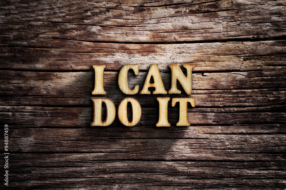Fototapeta premium I can do it. Words on old wooden board.