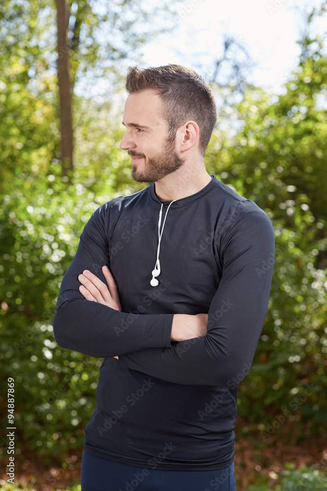 Handsome sporty man tired runner resting after evening jog, fit Handsome sporty man tired runner resting after evening jog, fit