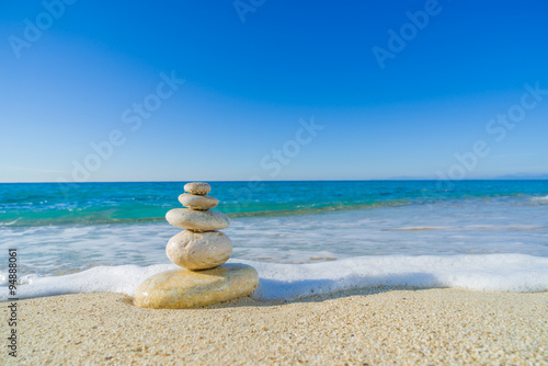 Fototapeta Naklejka Na Ścianę i Meble -  Stones balance, pebbles stack over blue sea in Croatia.
