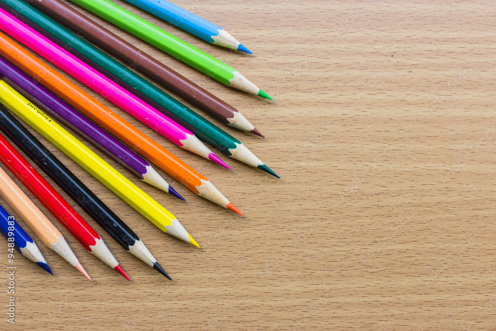 Obraz premium Color pencils on wooden background