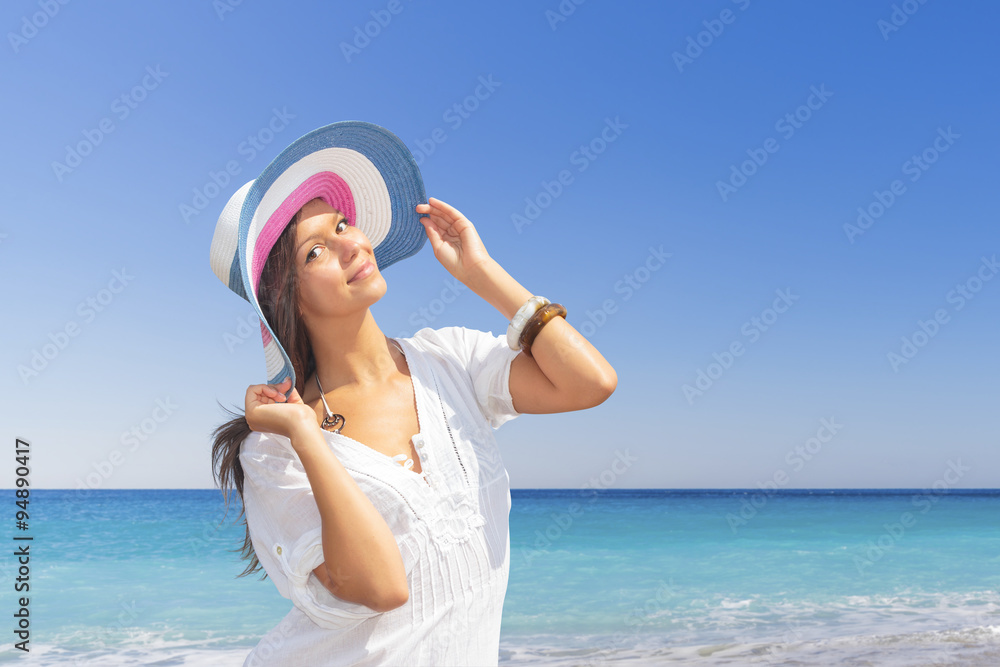 woman in white clothing refreshing at the ocean woman in white clothing refreshing at the ocean