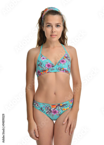 Young beautiful woman posing in modern summer bikini swimsuit