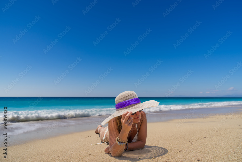  woman in sun hat and bikini at beach.remote tropical beaches an