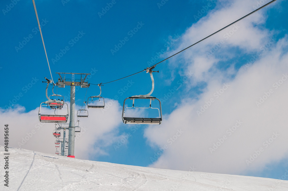 Ski lifts durings bright winter day Ski lifts durings bright winter day