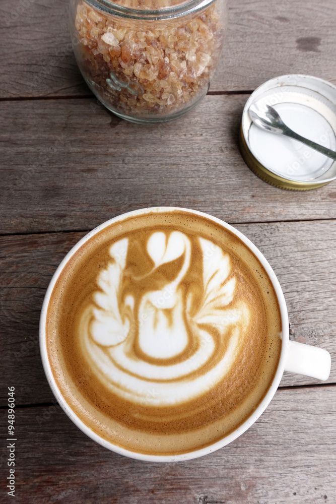 cup of latte art coffee on wooden background cup of latte art coffee on wooden background