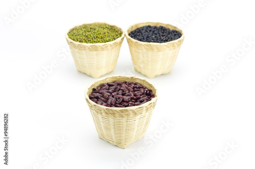 Kidney beans in bamboo basket isolate on white