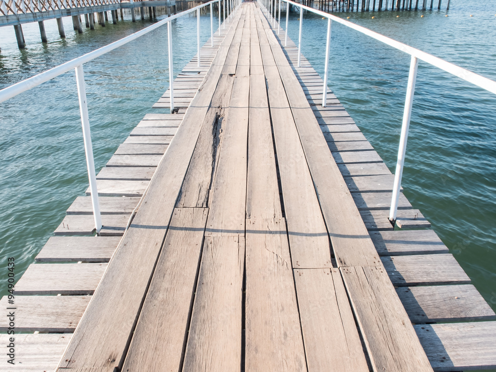 Wood bridge with eye line on blue sea