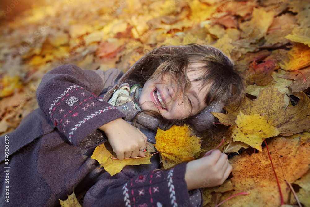 Young girl laughs in the autumn park Young girl laughs in the autumn park