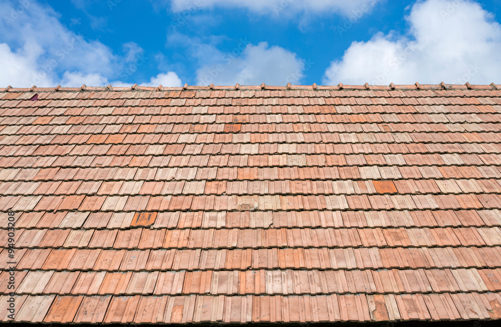 Roof tiles and blue sky with clouds Roof tiles and blue sky with clouds