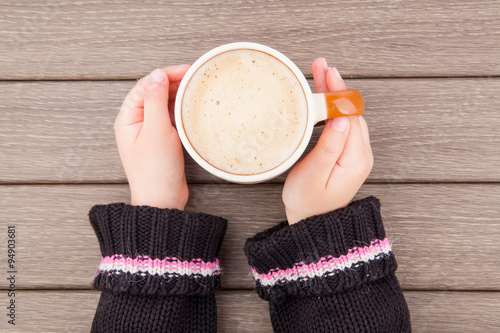 Girl hand with coffee