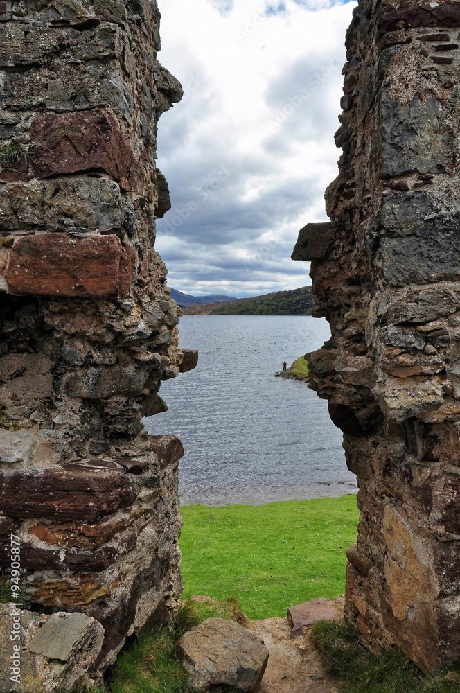 Lake landscape from a window view of ruined castle, Scotland