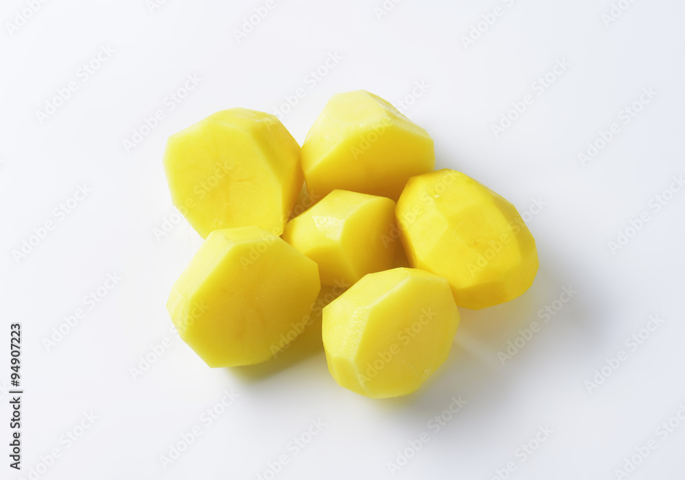Halved peeled potatoes