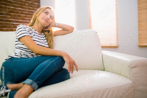 Pretty blonde relaxing on the couch