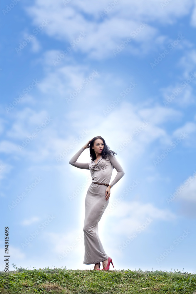 Young woman in sexy long gray dress Young woman in sexy long gray dress