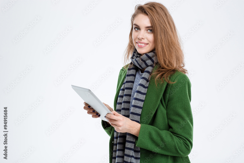 Smiling woman holding tablet computer Smiling woman holding tablet computer