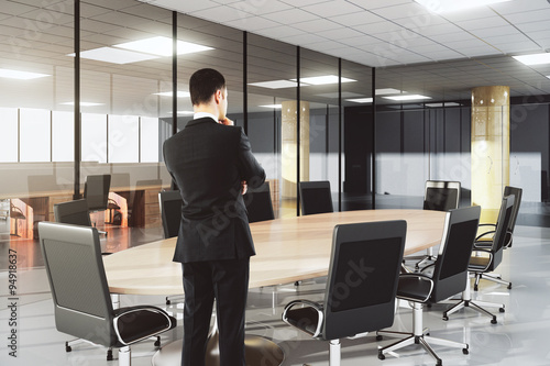 Businessman in modern conference office with furniture