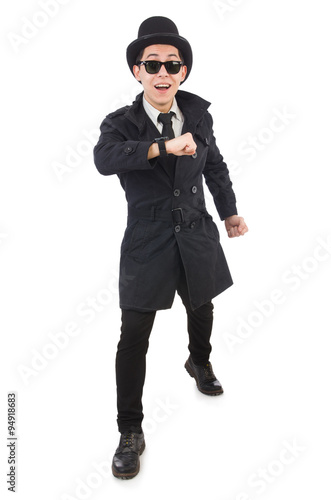 Young detective in black coat isolated on white