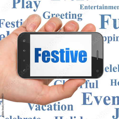 Entertainment, concept: Hand Holding Smartphone with Festive on display