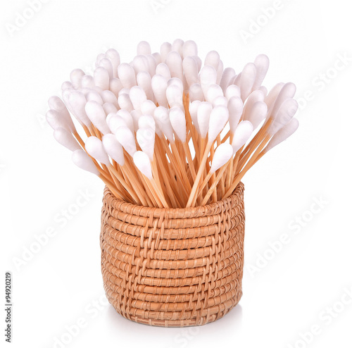 Cotton bud in the basket on white background