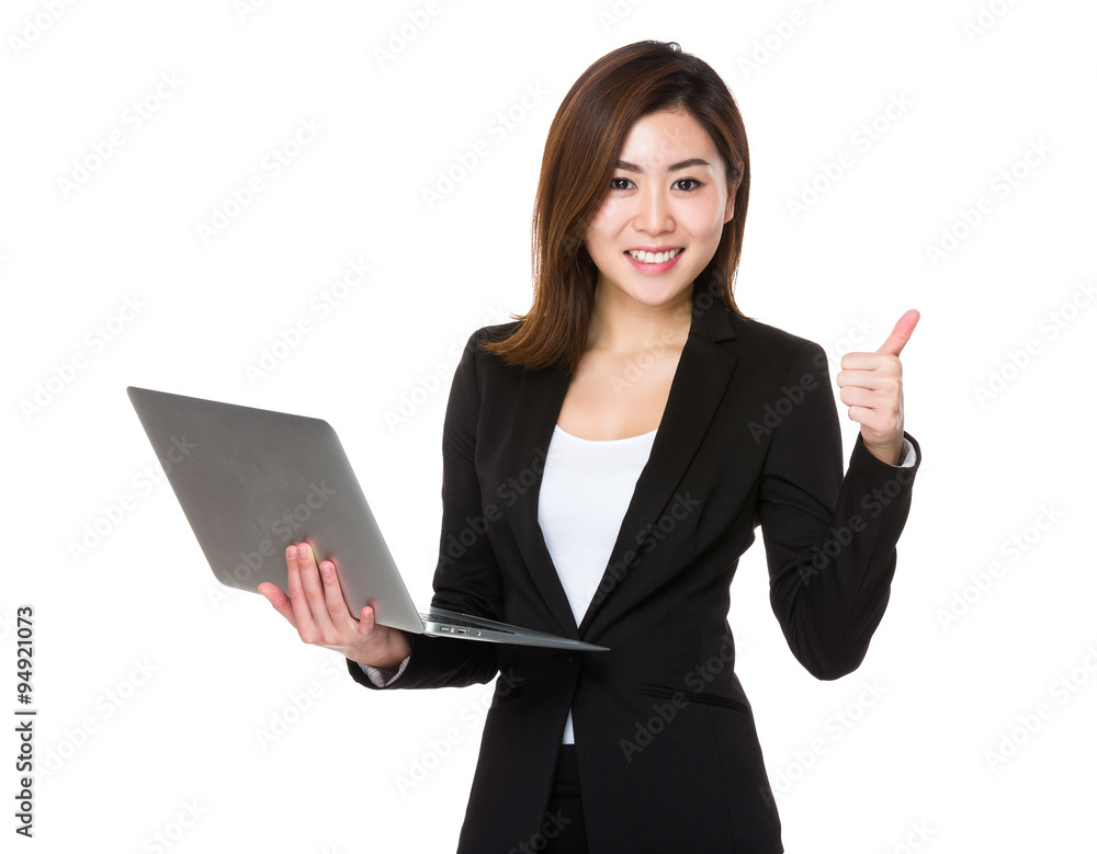 Asian Businesswoman hold with laptop computer and thumb up Asian Businesswoman hold with laptop computer and thumb up