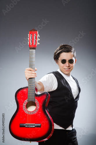 Funny guitar player in musical concept