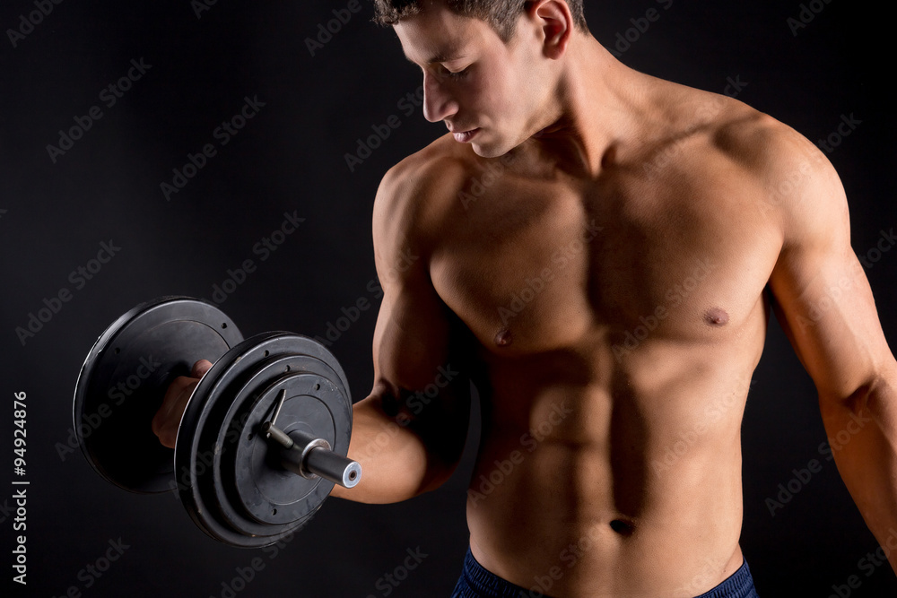 Strong athletic man on black background Strong athletic man on black background