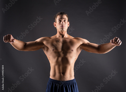 Strong athletic man on black background © fotofabrika