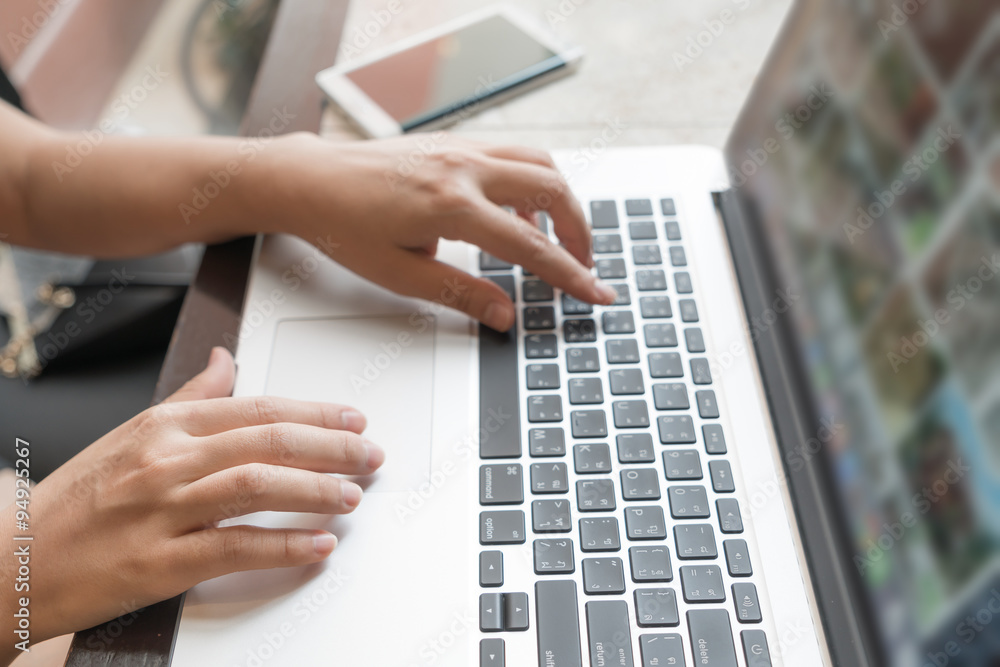 Closeup of business woman hand typing on laptop keyboard Closeup of business woman hand typing on laptop keyboard
