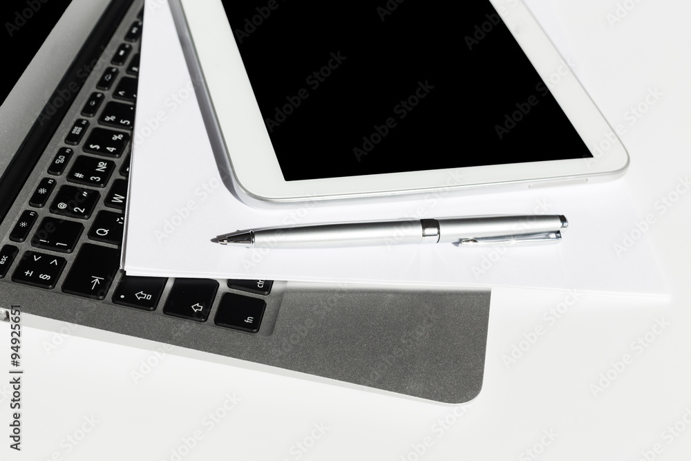 Open laptop with digital tablet and white smartphone Open laptop with digital tablet and white smartphone