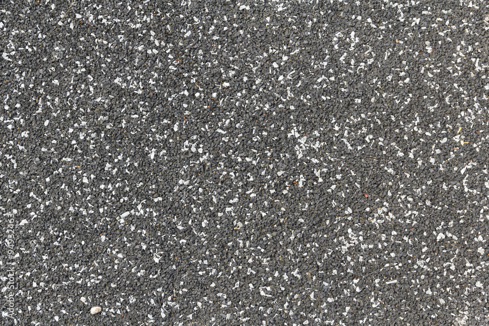 Playground soft rubberised impact absorbing safety surface black with white speckles texture
