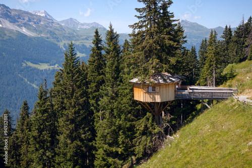 Alpine wooden treehouse in switzerland