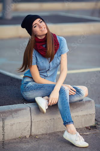 young woman in urban wear style with different emotions on parki