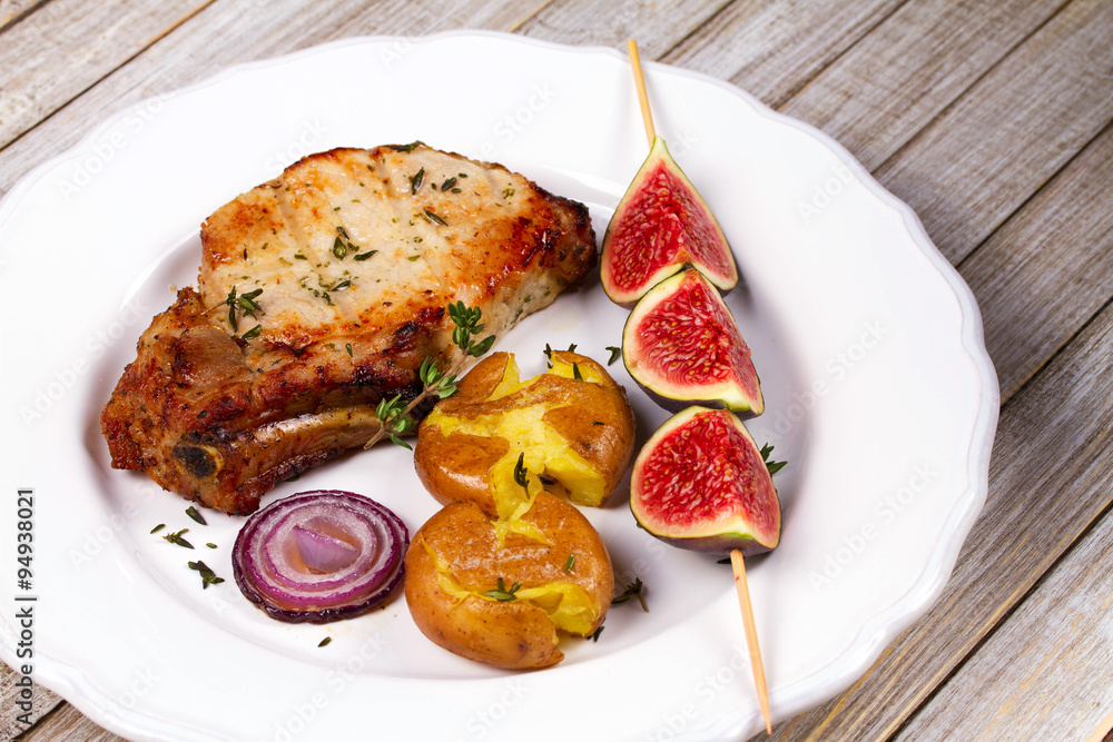 Grilled Pork Chop with Figs on Scewer, Crisp Roasted Potatoes and Thyme Grilled Pork Chop with Figs on Scewer, Crisp Roasted Potatoes and Thyme