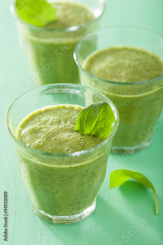 healthy green spinach smoothie with leaves